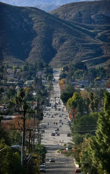 Street in Grand Terrace, CA running straight toward the hills and ridgeline above town