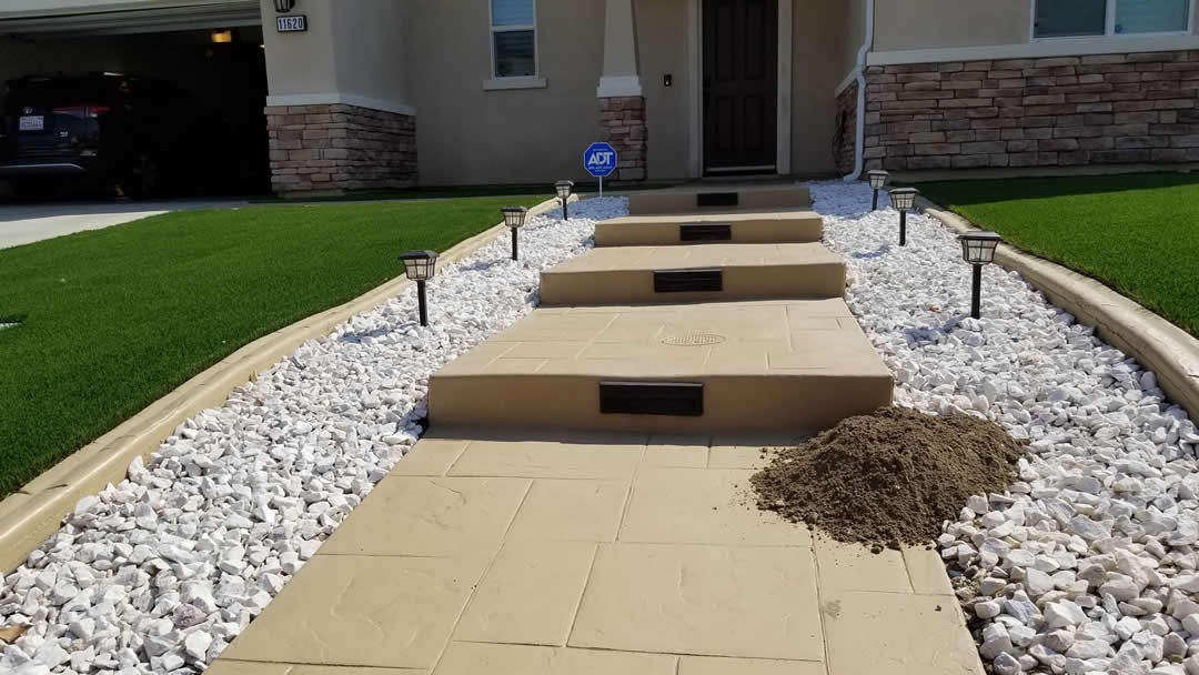 Fresh gopher mound pushed up through white rock landscaping at a Corona, California home near the Chino Hills State Park edge